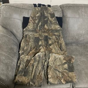 Insulated Camo bibs Size Med Does have a rip in the seam but can be easily sewn